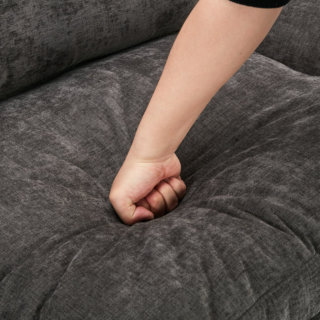 Child's fist on a gray textured surface