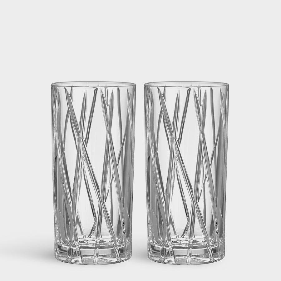 Two crystal glasses with a geometric pattern on a white background