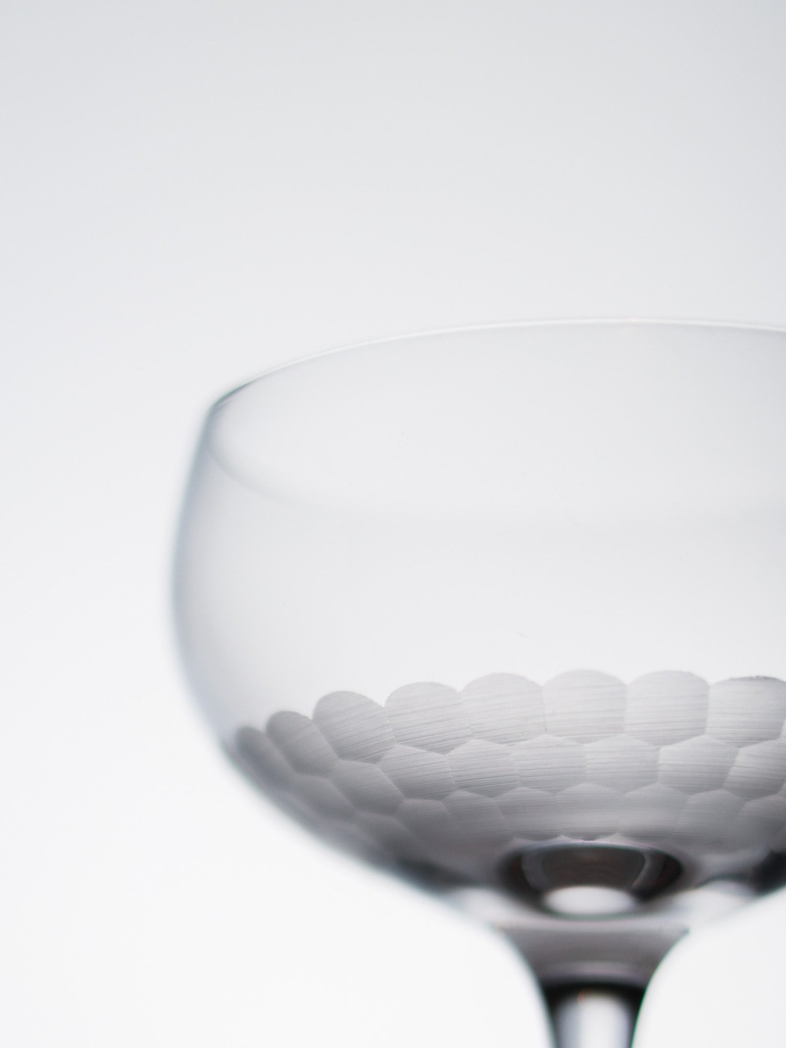 Close-up of a textured glass on a white background