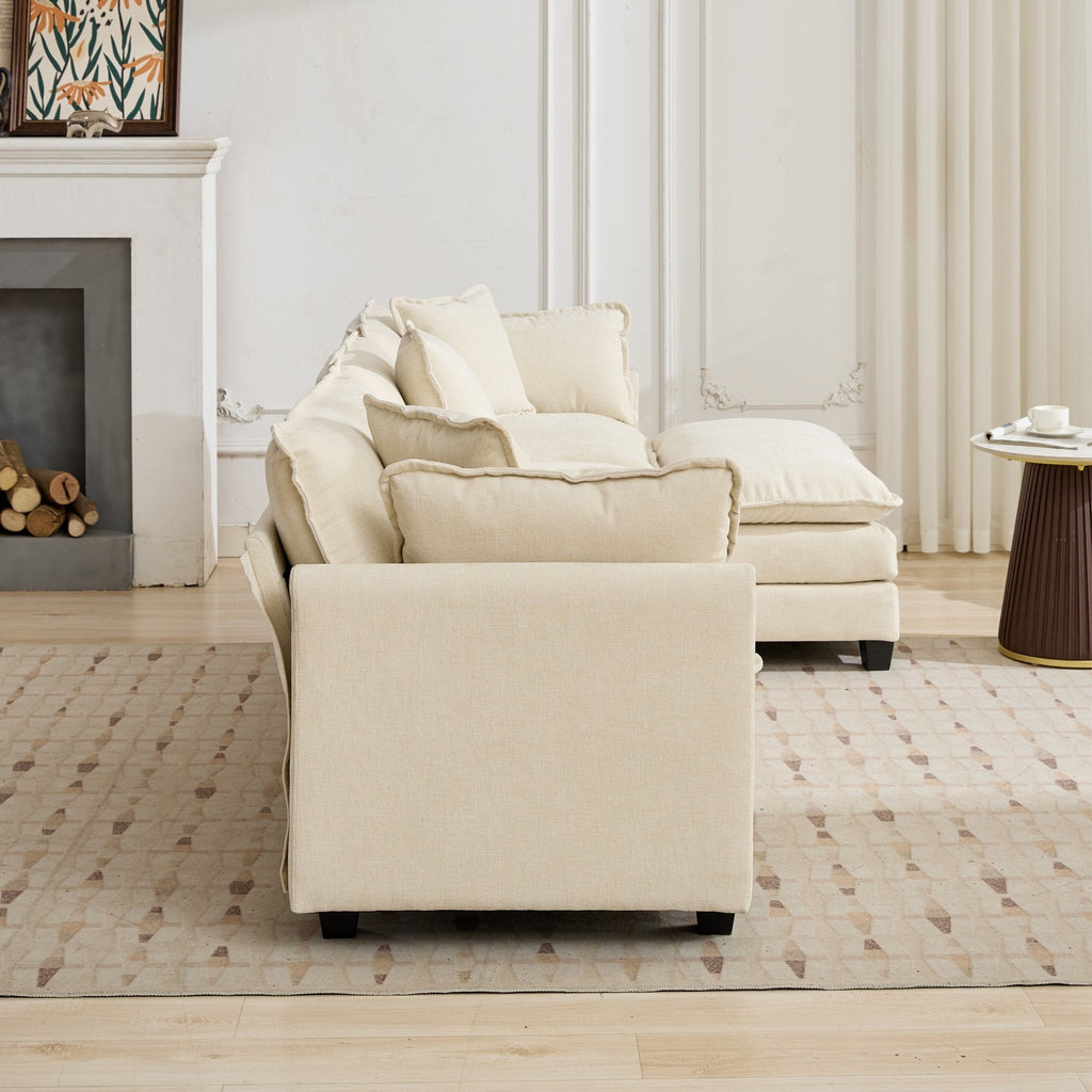Beige sectional sofa in a living room with a fireplace and patterned rug.