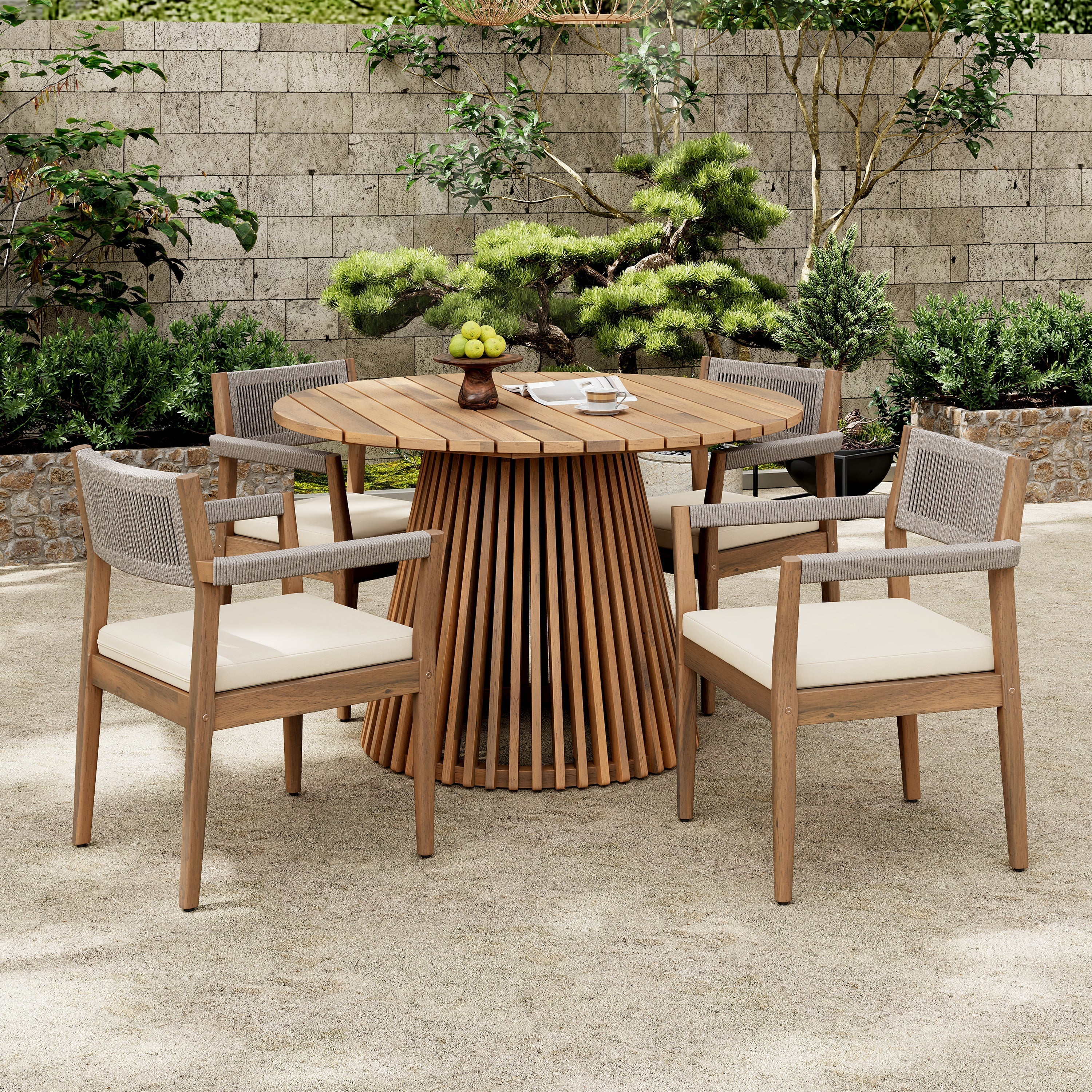 Outdoor wooden dining set with round table and chairs on a patio