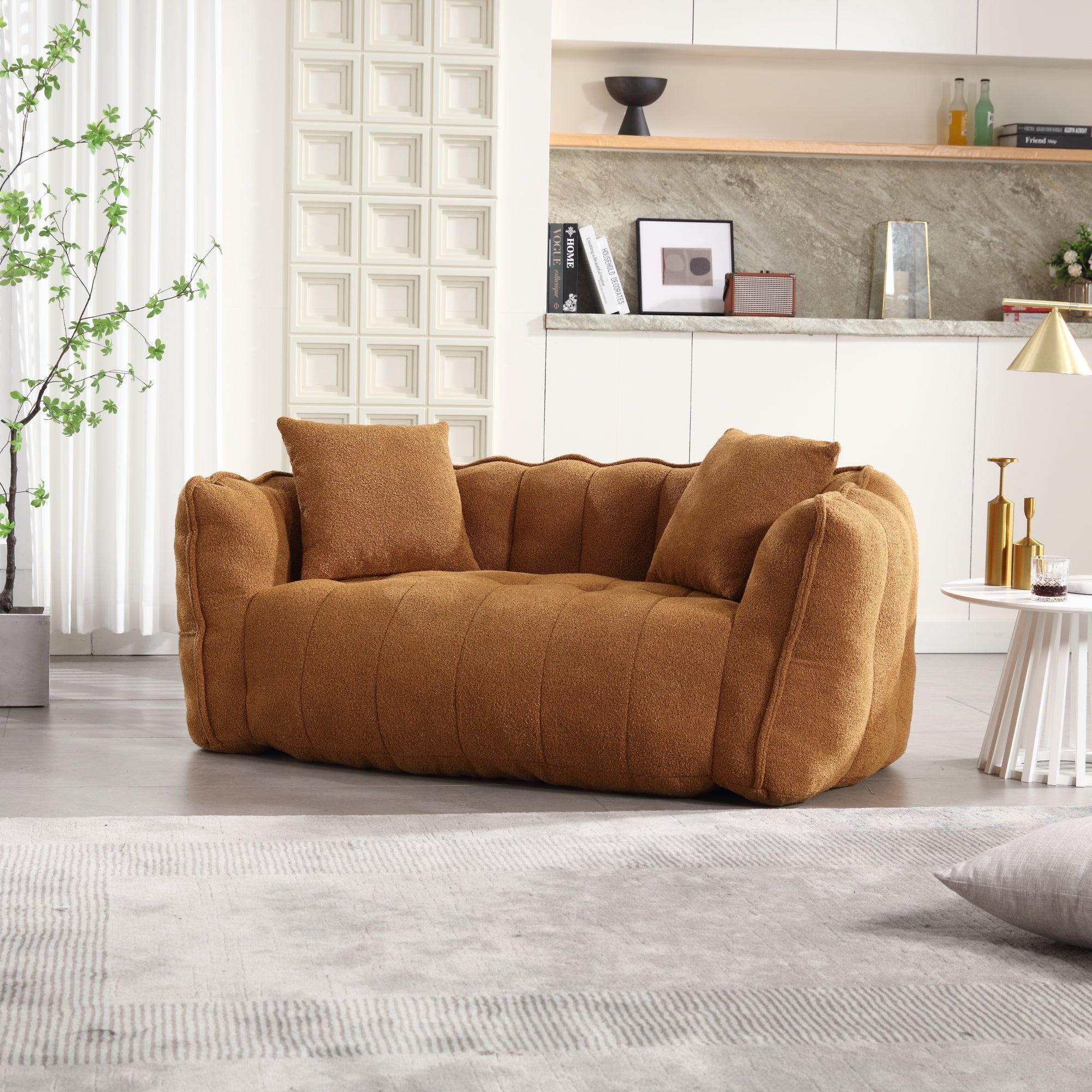 Brown sofa in a modern living room with decorative elements.