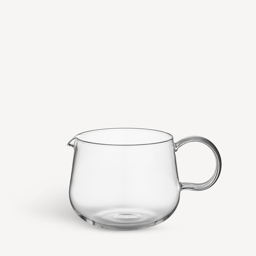 Clear glass tea pot on a white background