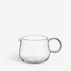 Clear glass tea pot on a white background