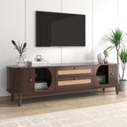 Wooden TV stand with a television mounted on a white wall, featuring decorative items.