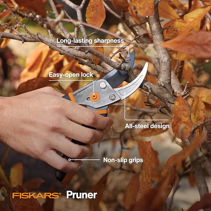 Fiskars pruner being used on a branch with text highlighting features, set against an autumn background.