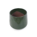 A small cylindrical ceramic planter in a glossy dark forest green glaze, shown on a plain white background.