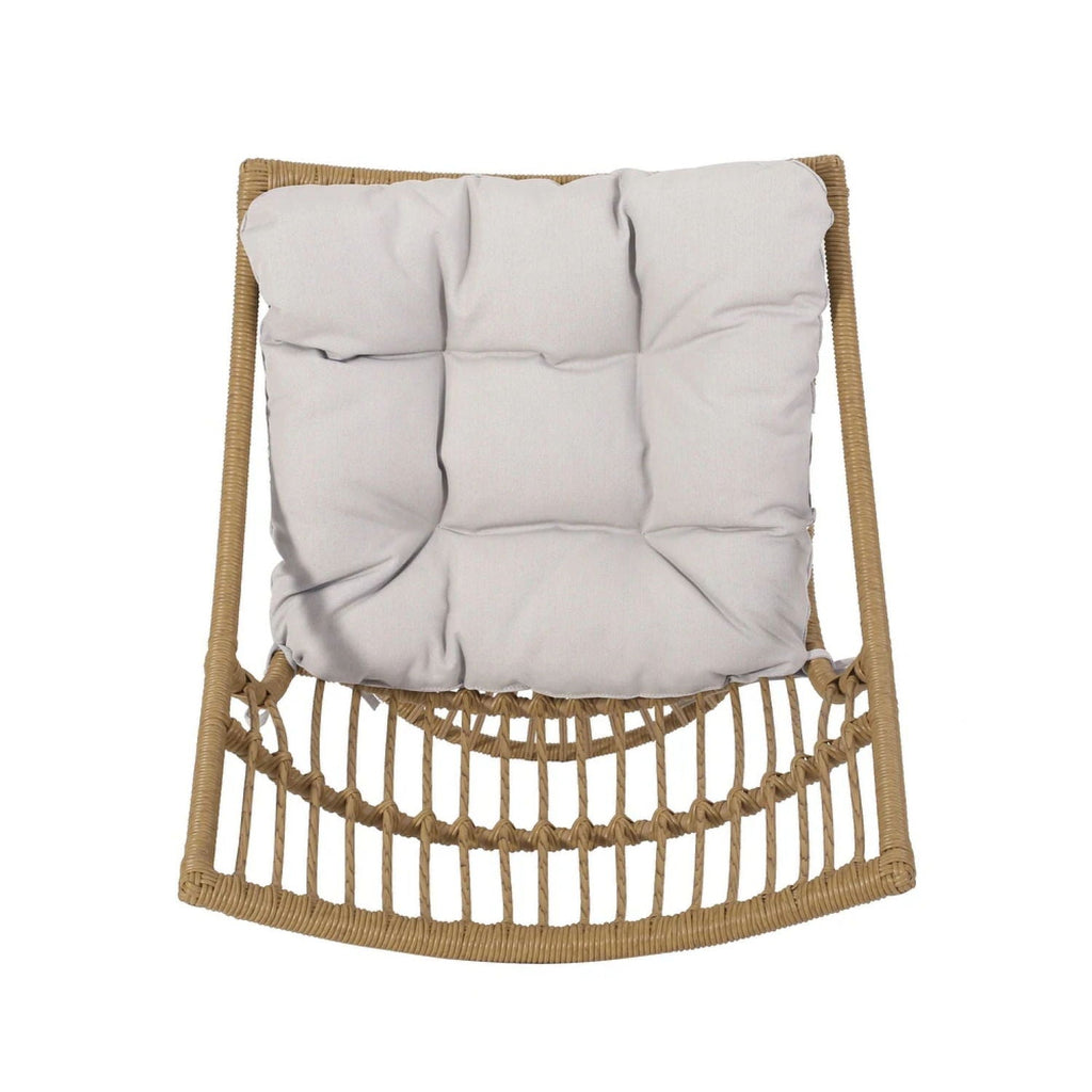 Woven chair with a gray cushion on a white background