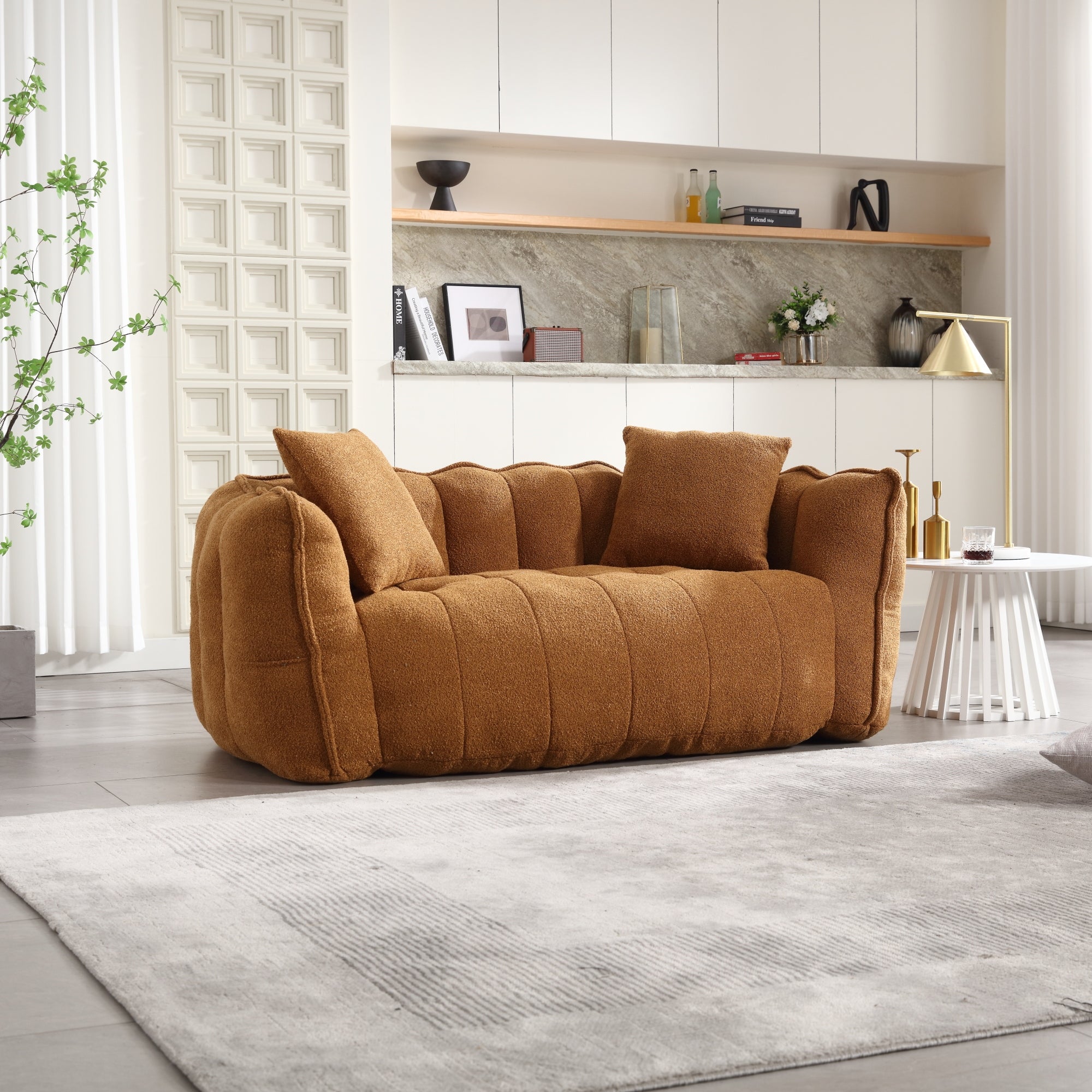 Brown sofa in a modern living room with a neutral color palette