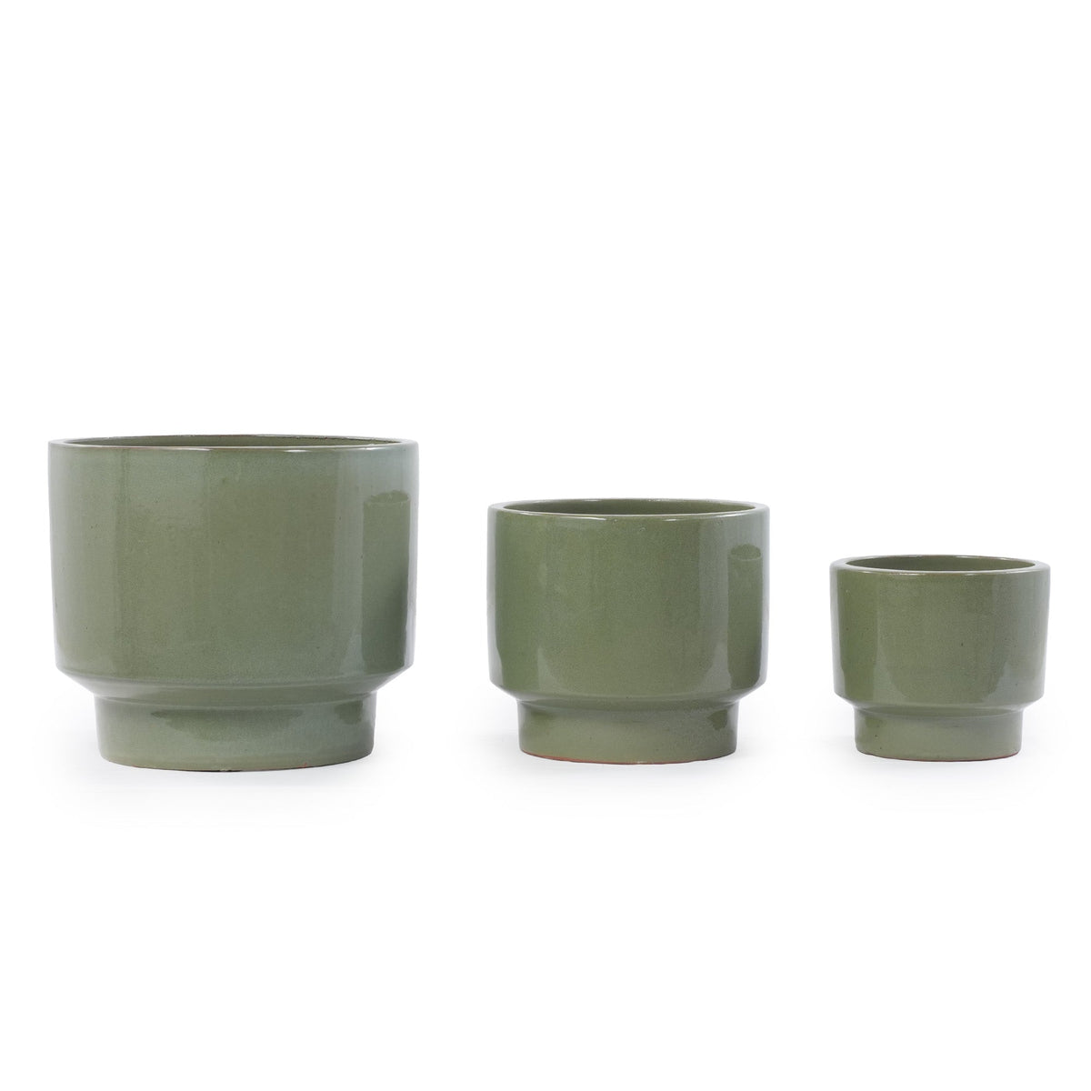 Three ceramic planters in a matching muted sage green glaze, arranged by size from left to right on a plain white background.
