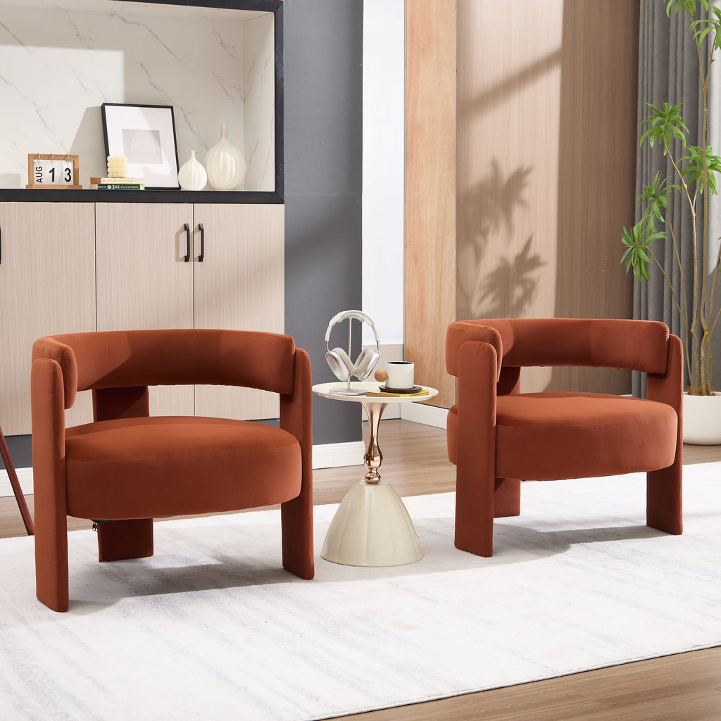 Two brown armchairs in a modern living room setting with a side table and decor.