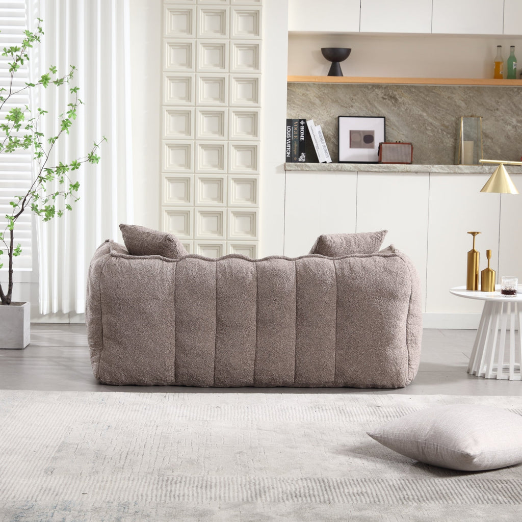 Gray sofa in a modern living room with decorative elements.
