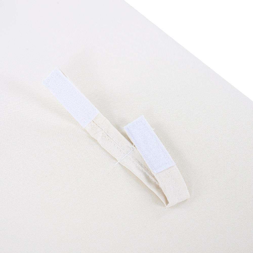 Close-up of a white shirt with a label on a light gray background