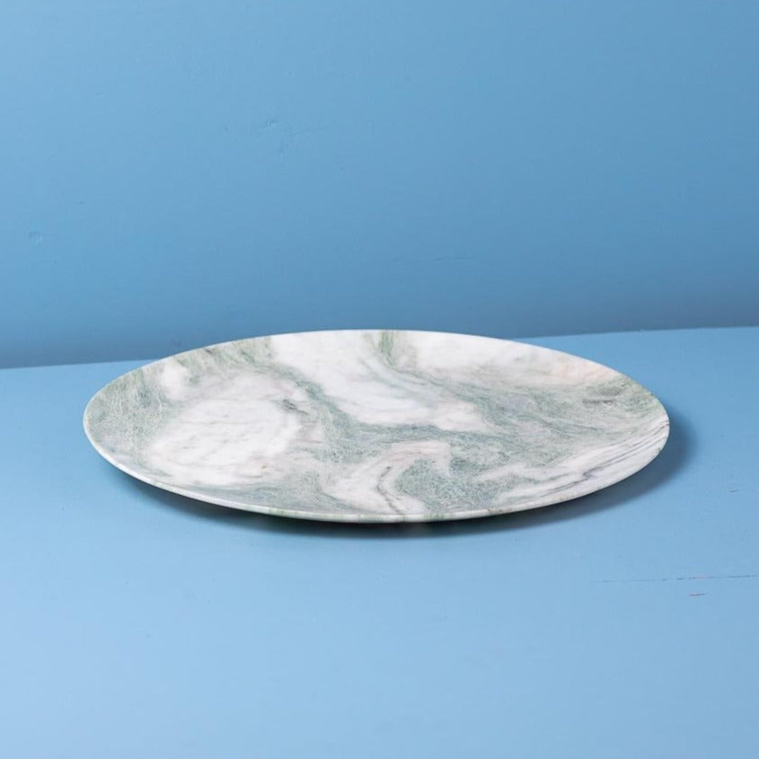 Marble-patterned plate on a blue background