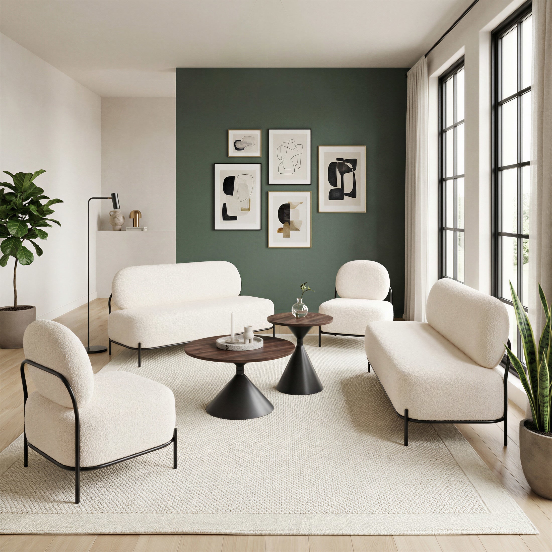 Modern living room with white furniture, black tables, and framed art on a green wall.