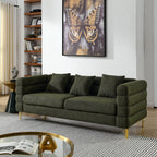 Green sofa in a living room with a butterfly artwork on the wall.