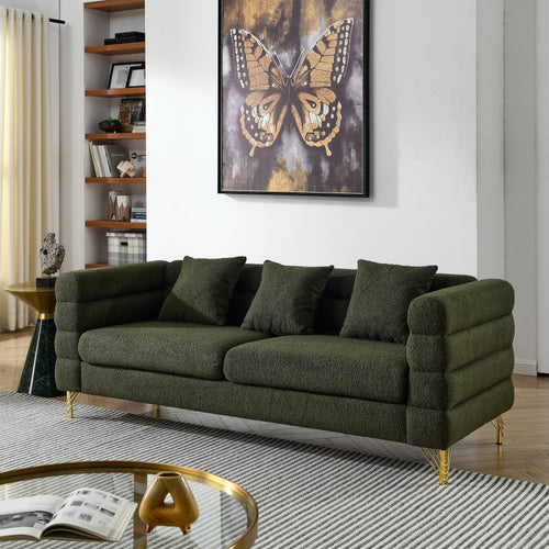 Green sofa in a living room with a butterfly artwork on the wall.