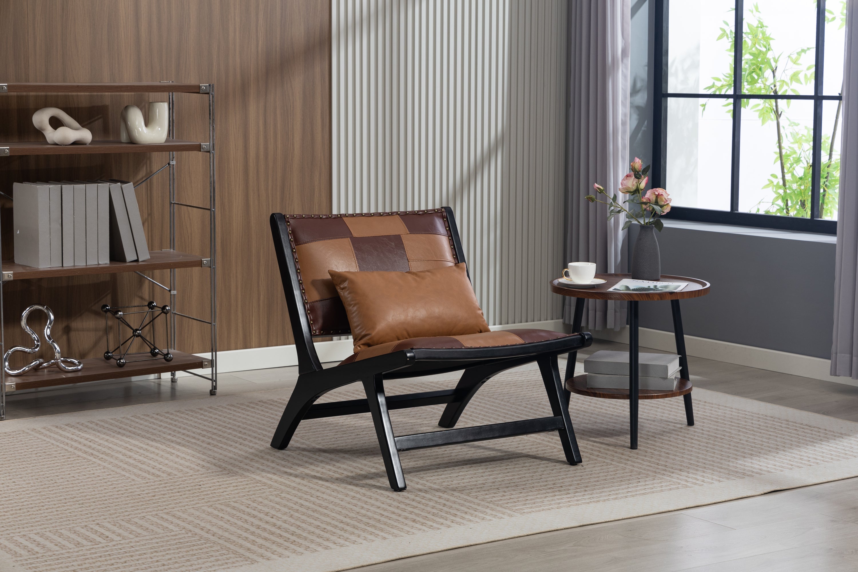 Modern living room with a brown and black chair, side table, and bookshelf.