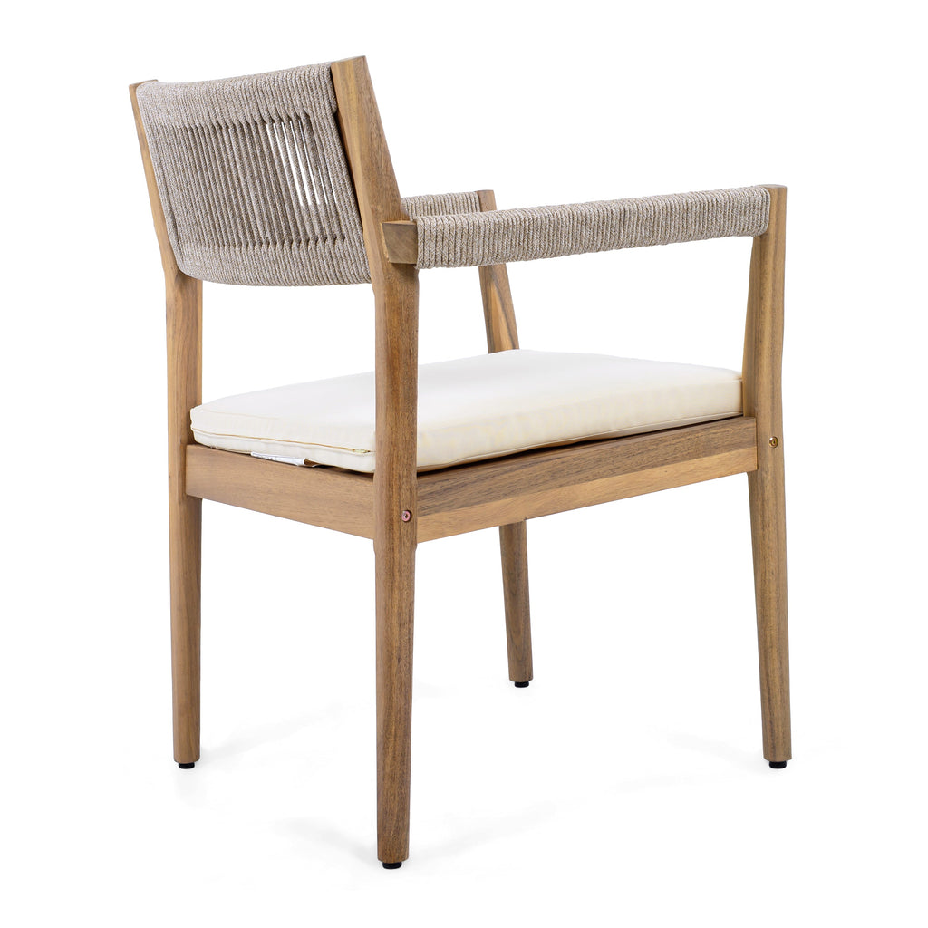 Wooden chair with woven backrest and white cushion on a white background