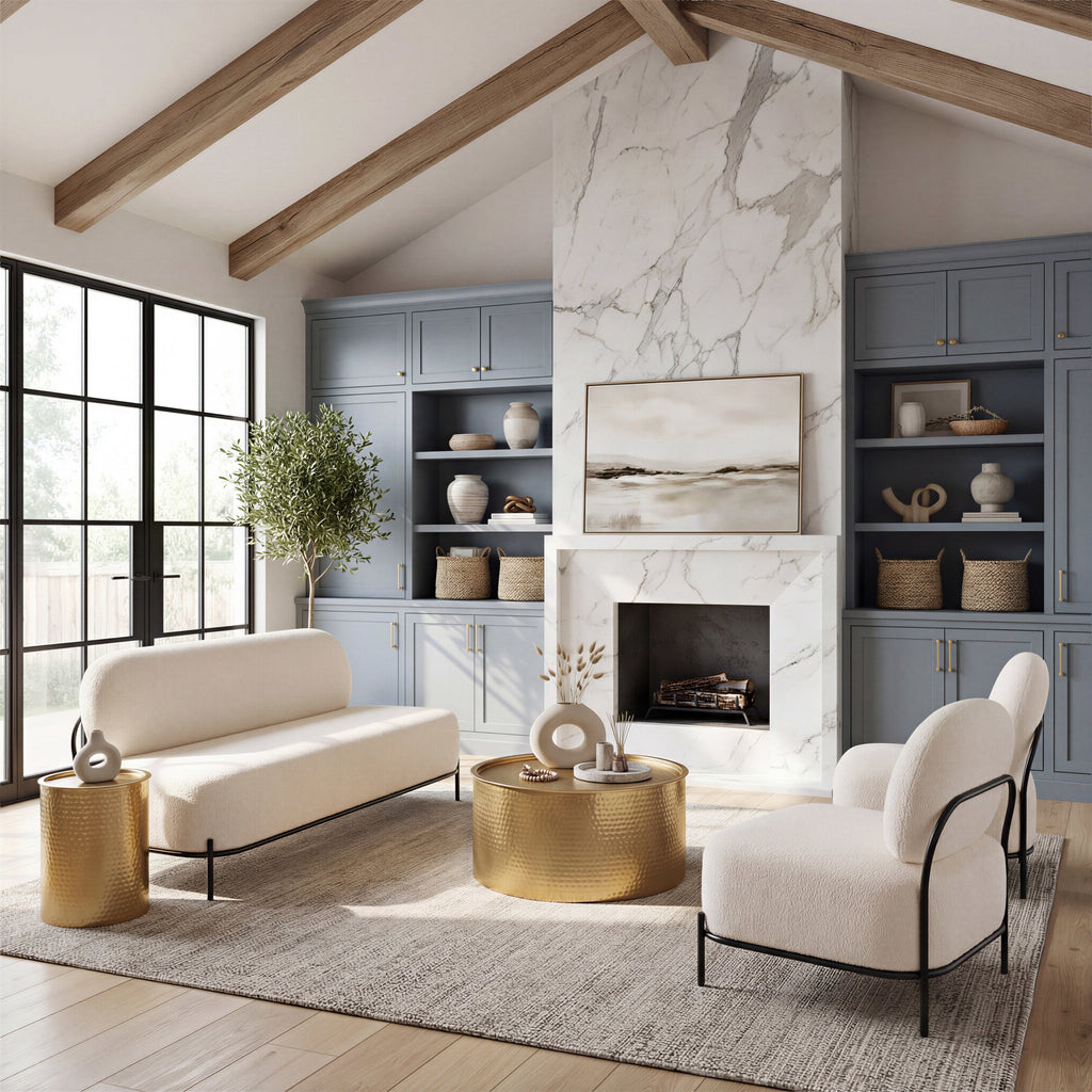 Modern living room with white sofa, gold coffee table, and marble fireplace.
