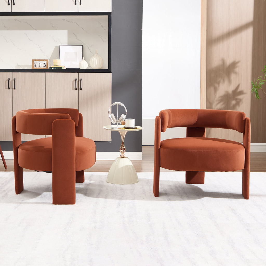 Two orange chairs in a modern living room setting with a side table.