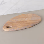 Wooden cutting board on a neutral background