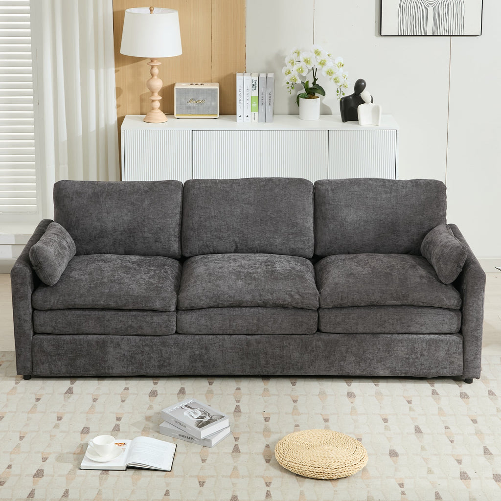 Gray sofa in a living room setting with decor items.