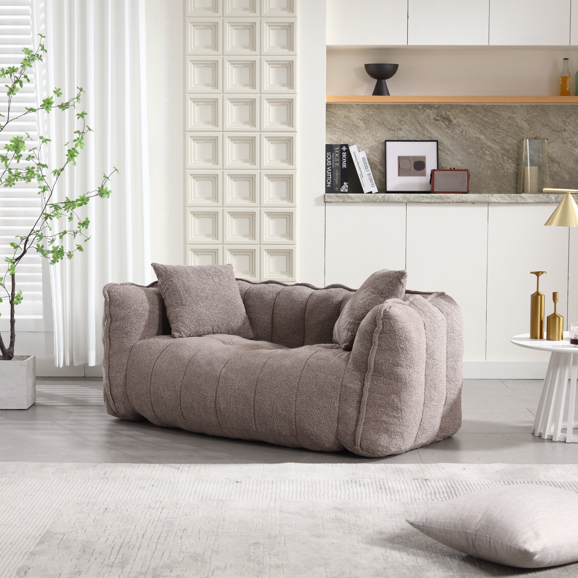 Gray sofa in a modern living room with decorative elements.