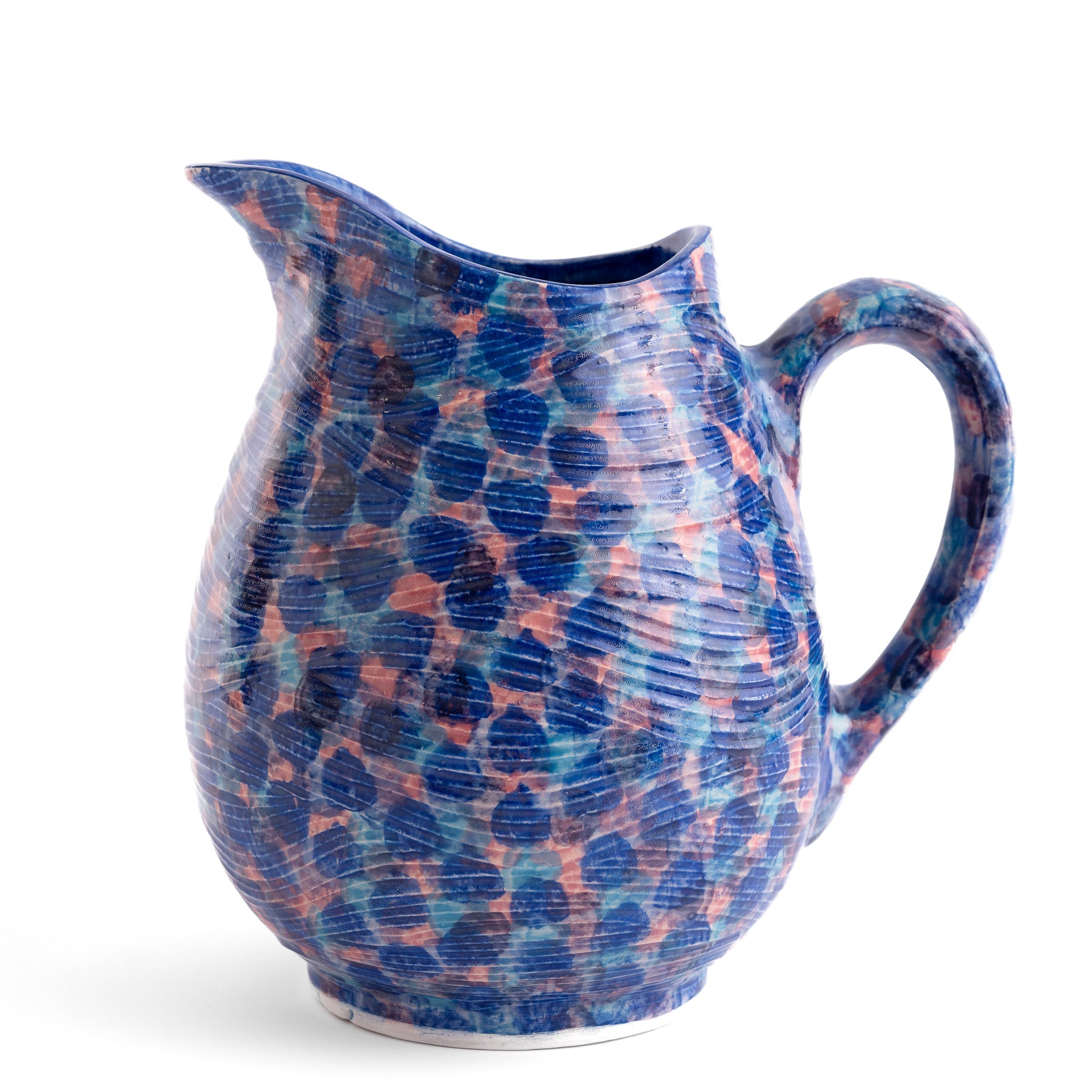 Ceramic pitcher with blue and pink speckled pattern on a white background