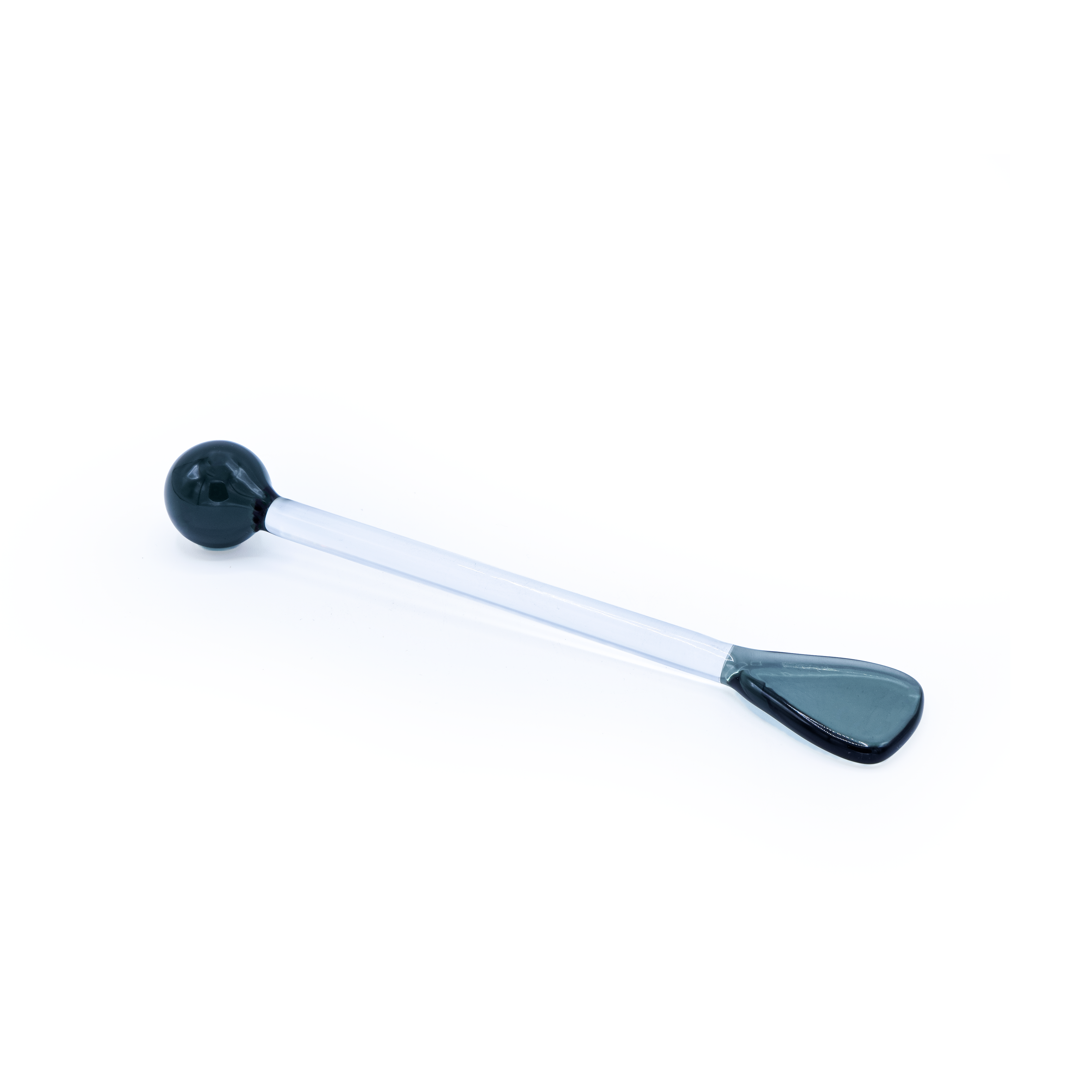 Black and white glass spoon on a white background