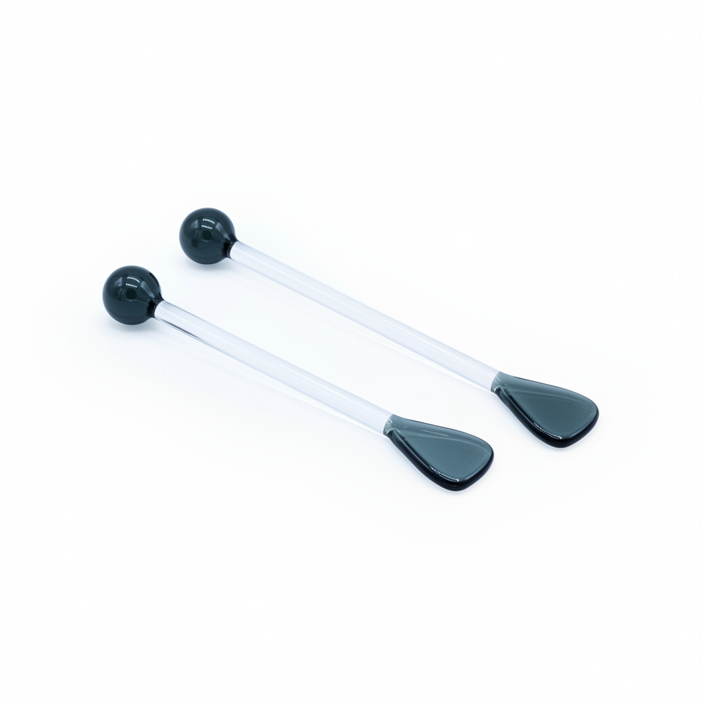 2 Black and white glass spoon on a white background