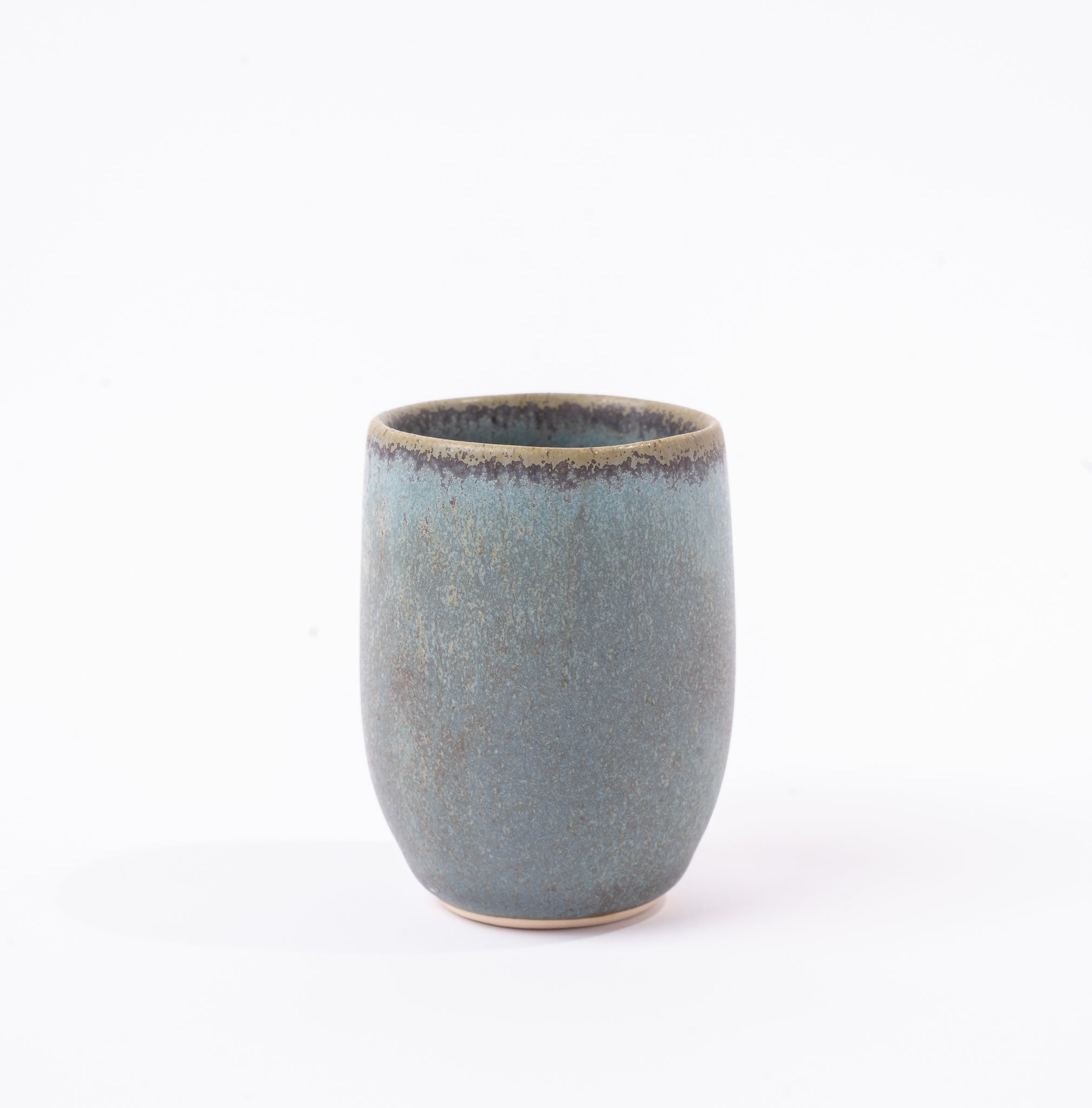 Blue ceramic cup on a white background
