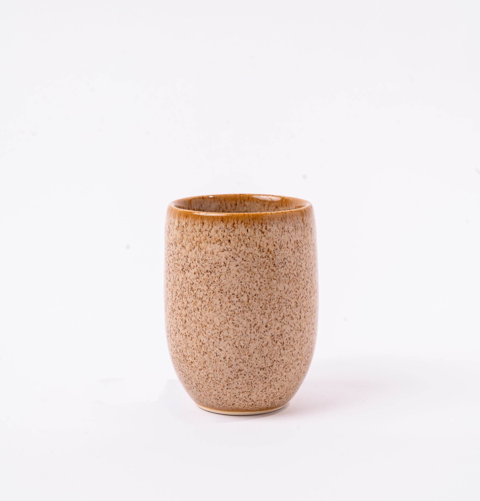 Brown ceramic tumbler on a white background