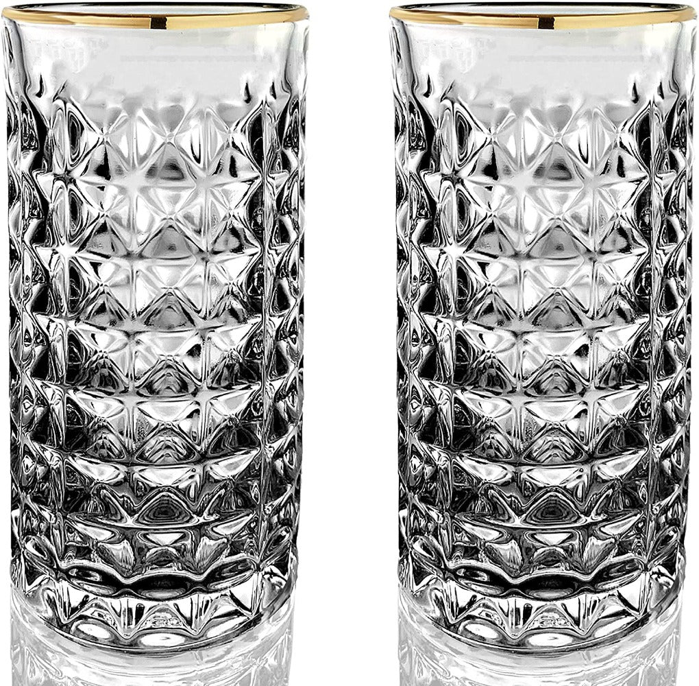 Two clear glass tumblers with gold rims on a white background
