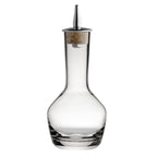 Clear glass decanter with wooden stopper on a white background