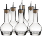 Set of six clear glass decanters with metal nozzles on a white background