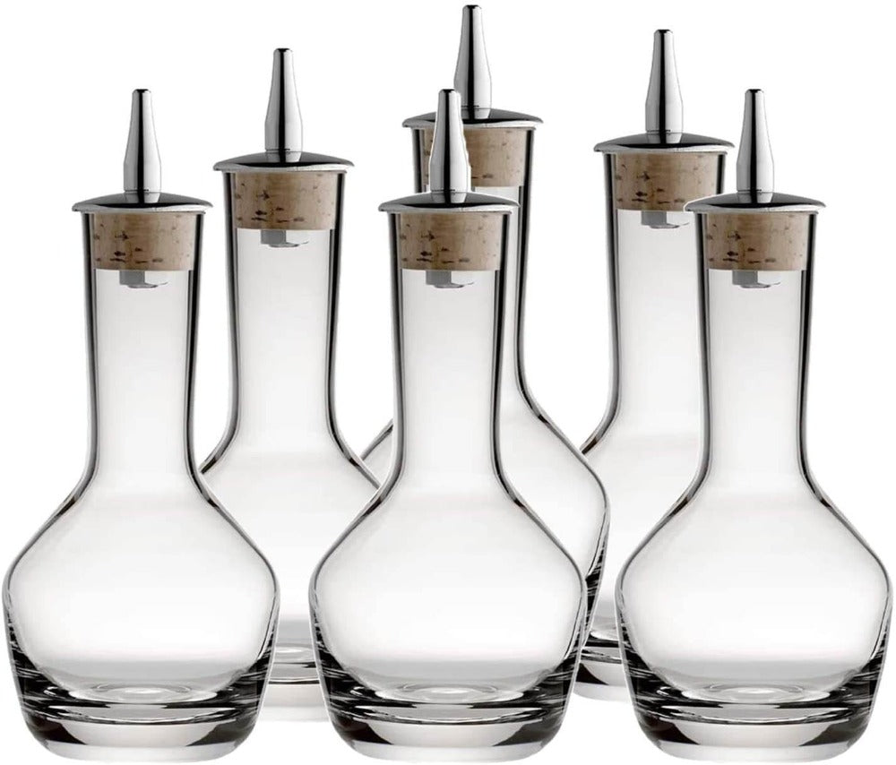 Set of six clear glass decanters with metal nozzles on a white background