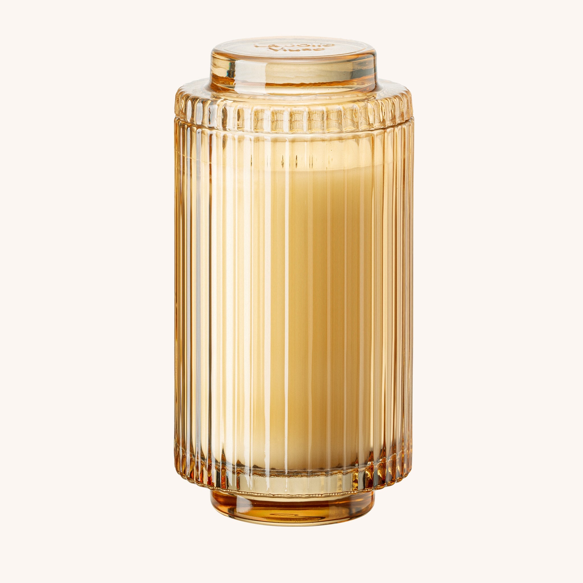 Gold cylindrical container with ribbed design on a white background