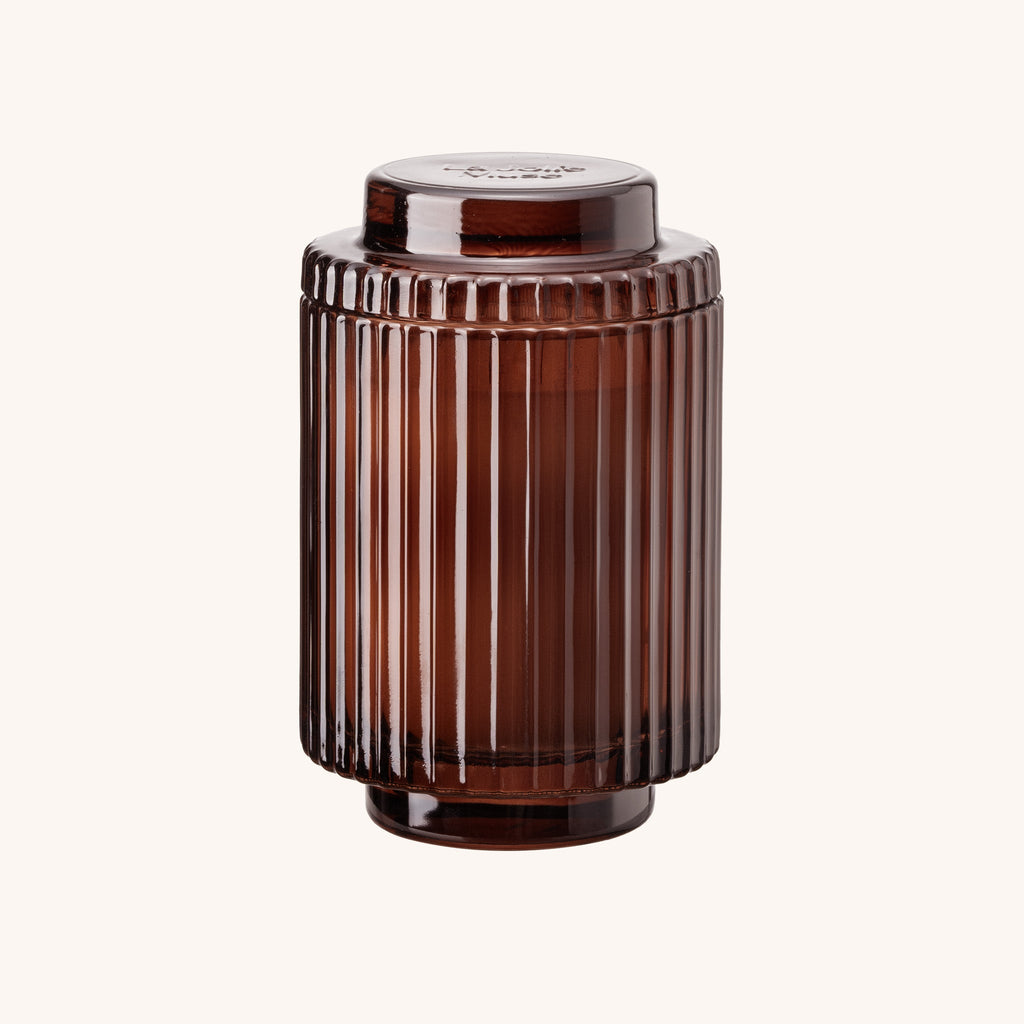 Brown ribbed cylindrical container on a white background