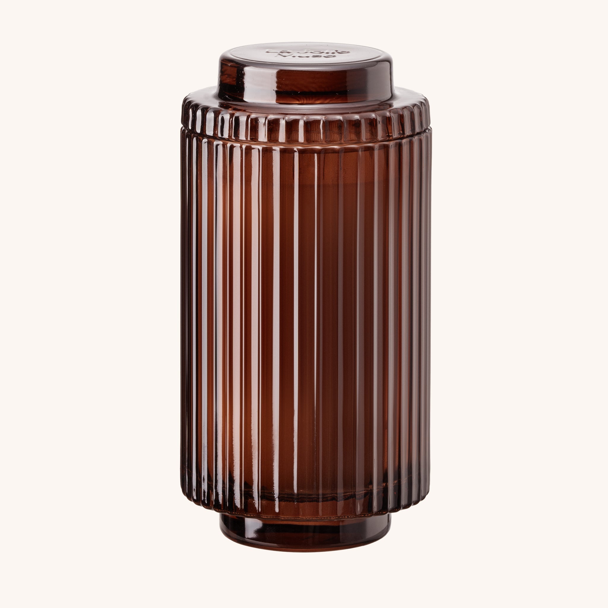 Brown ribbed container on a white background