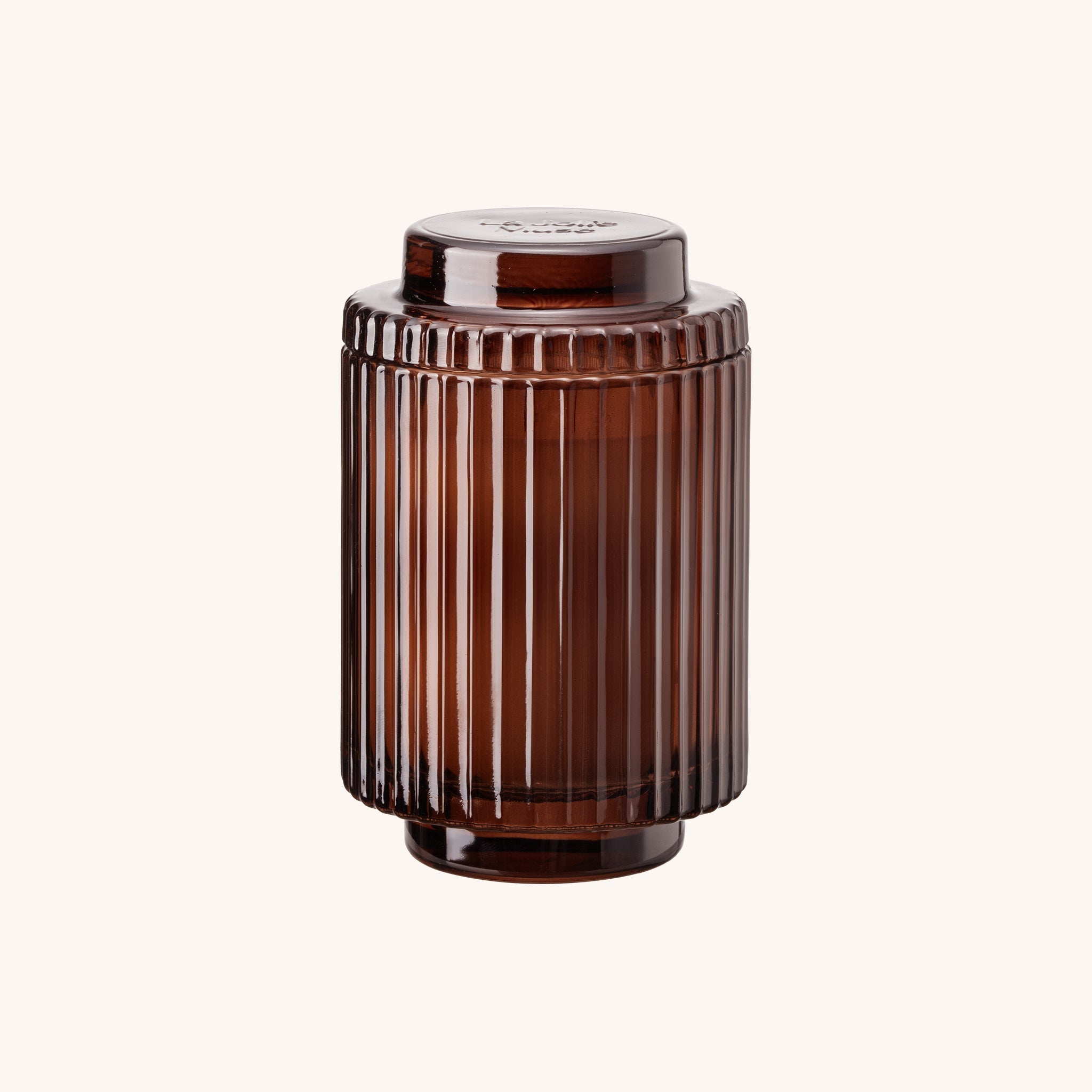 Brown ribbed cylindrical container on a white background