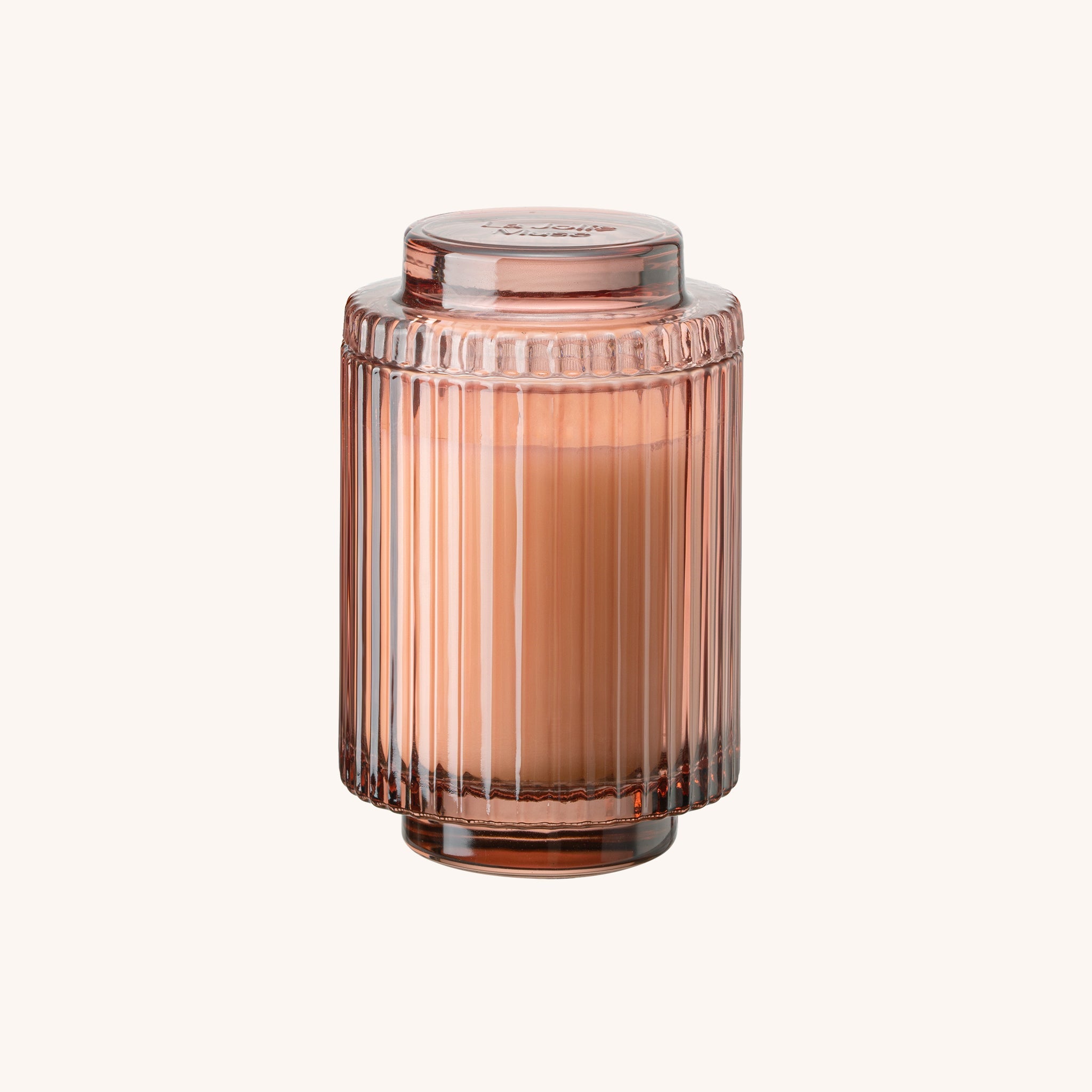 Rose gold glass candle holder on a white background