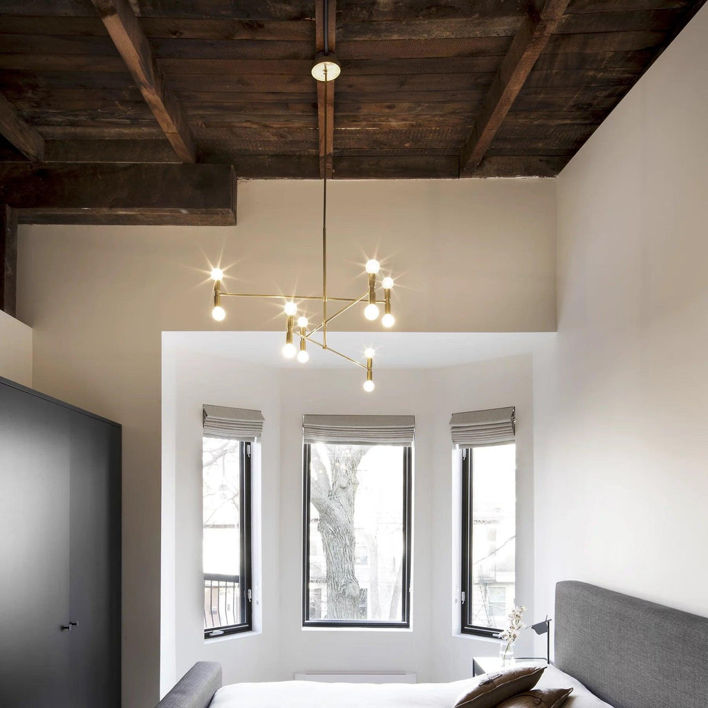 Modern bedroom with wooden ceiling, chandelier, and large windows.