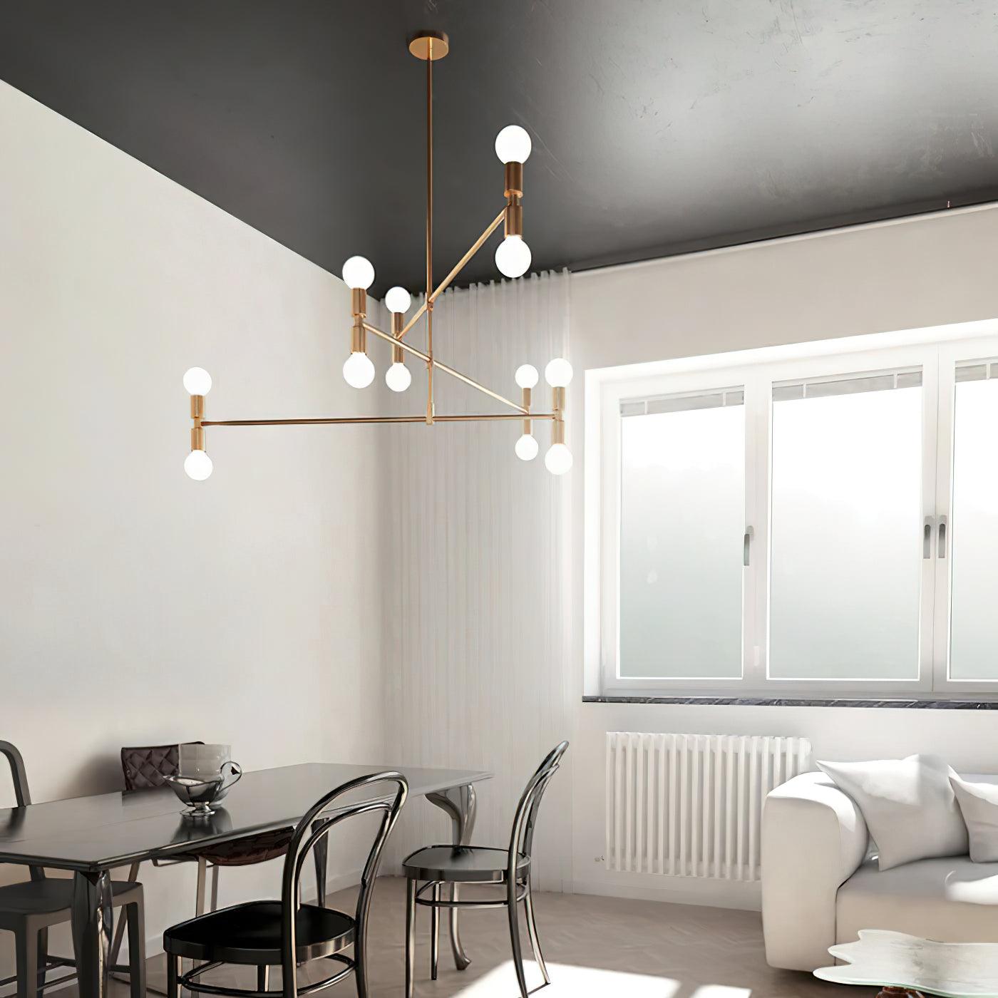 Modern living room with a chandelier, dining table, and sofa.