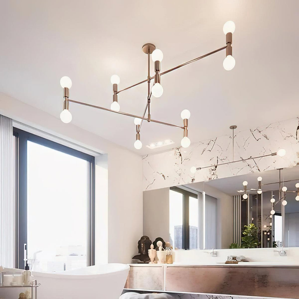 Modern chandelier hanging in a room with large windows and decorative elements.
