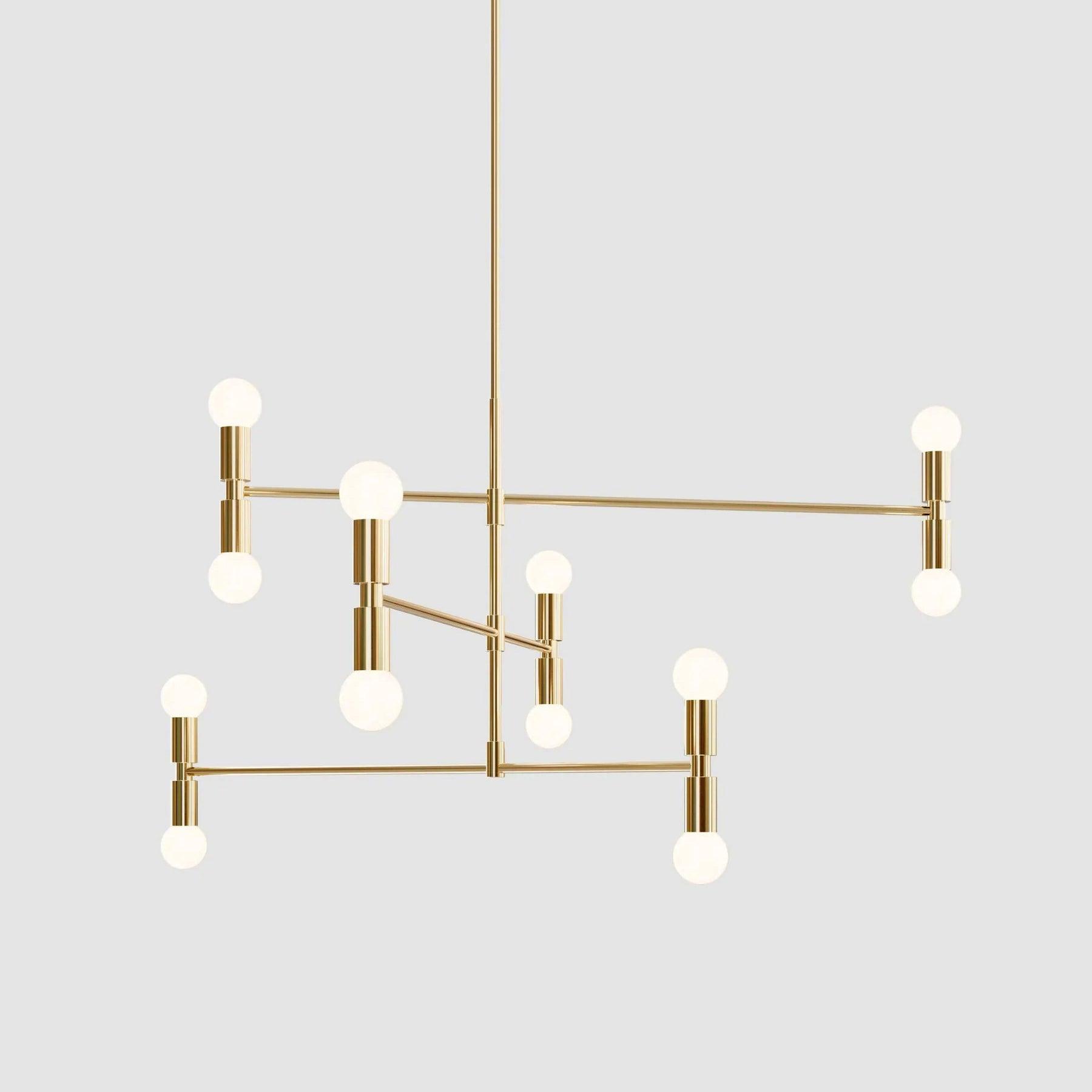 Modern chandelier with gold fixtures and white bulbs on a light gray background