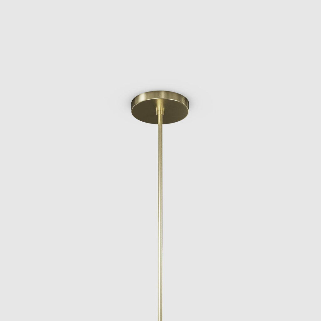 Gold pendant light fixture on a white background