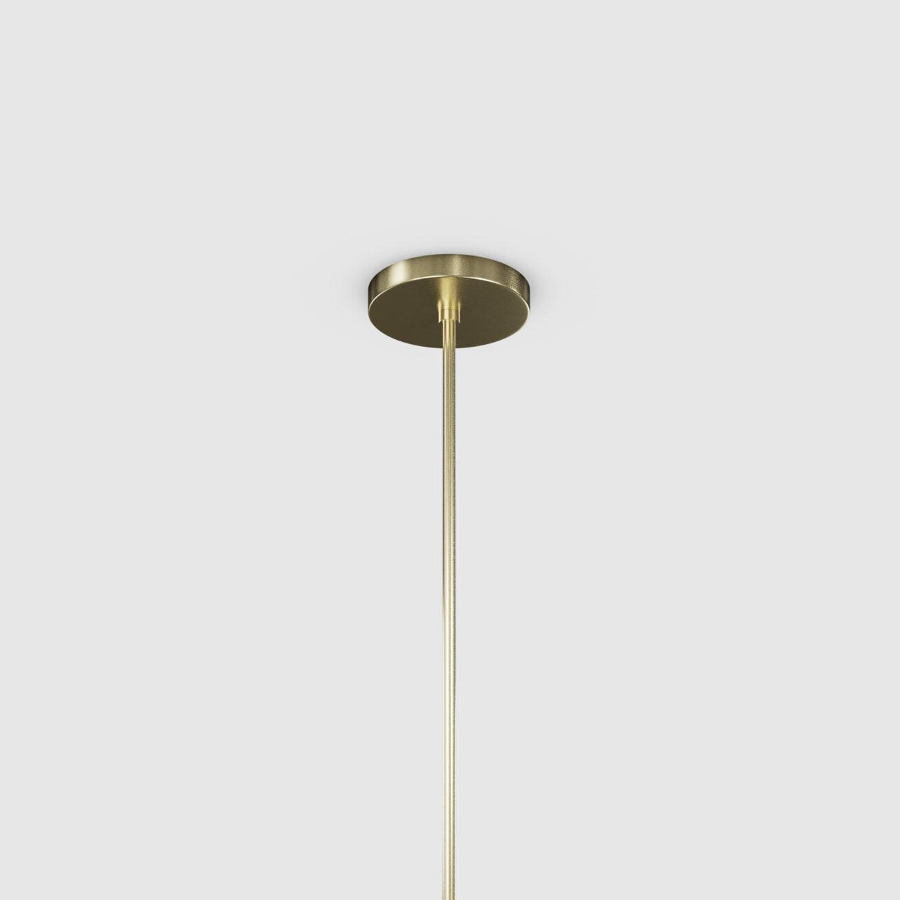 Gold pendant light fixture on a white background