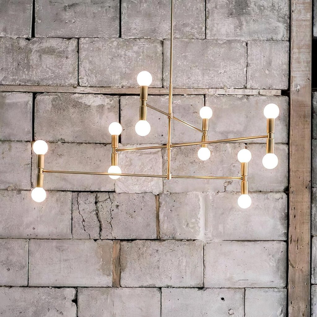 Modern chandelier with multiple lights against a textured stone wall.