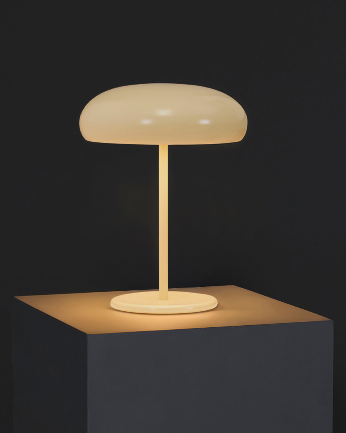 Beige table lamp on a dark background